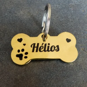 Médaille pour chien en inox effet miroir forme os, gravée au laser infrarouge avec nom et numéro. version dorée or / noir